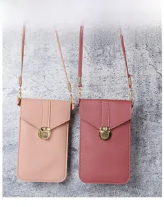 Detail of PU leather phone wallets with envelope flap and gold twist-lock closures