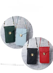 Detailed view of four colorful mini crossbody phone bags with round metal snap closures