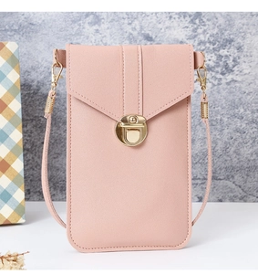Detail view of pink PU leather phone crossbody bag with golden metal twist lock closure