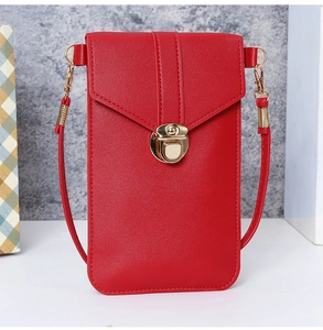 Detailed view of red PU leather vertical phone bag with gold-tone metal clasp