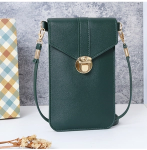 Close-up of dark green lychee grain PU leather phone bag with golden metal lock buckle