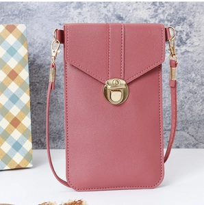 Detail view of pink PU leather phone bag with envelope flap and golden push-lock closure