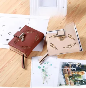Short leather wallets for women featuring leaf cutout design and metal pendant charms