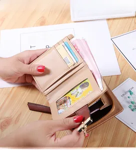 Detailed interior of a beige leather wallet showing card slots and zipper compartment
