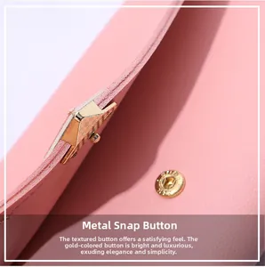 Close-up of pink litchi grain leather wallet featuring a premium gold metal snap button