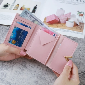 Pink faux leather tri-fold short wallet with V-shaped metal buckle for women