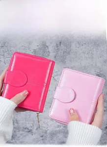 Detail of short oil wax leather wallet for women with snap closure and zipper coin pocket