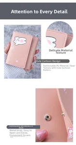 Detail of pink PU leather trifold wallet with bear print and metal snap button
