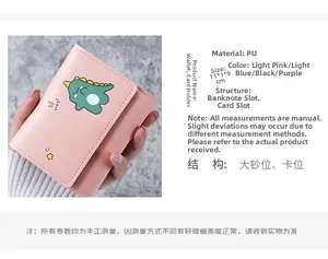 Detailed view of pink PU leather wallet showing cartoon dinosaur print and 11x1x9cm dimensions