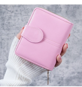 Macro shot of pink wax leather wallet with stitch detail and golden metal zipper