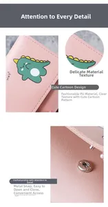 Close-up of pink PU leather wallet showing fine stitching, dinosaur print, and metal snap button