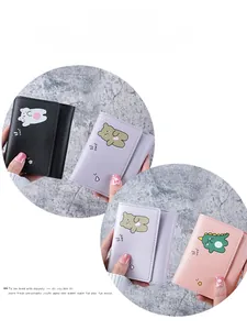 Close-up of trifold PU leather wallets with cute bear and dinosaur prints in pastel colors