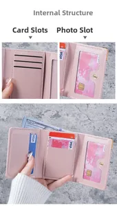 Detail view of pink trifold wallet interior showing card slots and transparent ID window