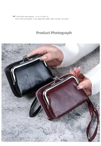 Detail view of mini PU leather wallets in black and wine red with metal kiss lock and strap