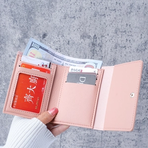 Pink tri-fold short wallet for women featuring multiple card slots and clear ID window
