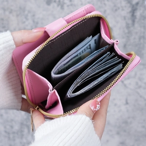 Pink vintage short wallet for women featuring card slots and a metal zipper coin pocket