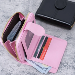 Short pink oil wax leather wallet with multiple card slots and secure coin pocket
