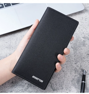 Close-up of black long leather wallet with cross-texture finish in a business setting