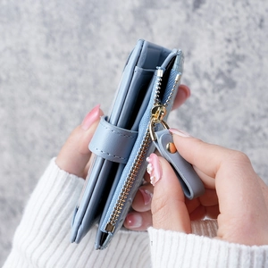 Women's light blue crocodile texture wallet with metal zipper and snap closure