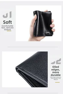 Macro shot of flexible black pebbled leather men's bifold wallet with smooth edge finish
