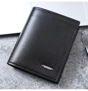 Close-up of black PU leather men's wallet with litchi texture and metal logo plaque