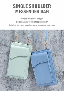 Close-up of light green and blue litchi pattern leather shoulder bags with gold zippers