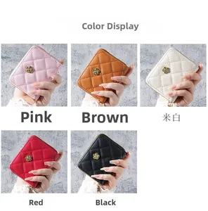 Detailed grid of quilted zip wallets featuring floral clasps in five elegant colors