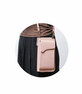 Pink faux leather crossbody phone bag with gold hardware and curved flap detail
