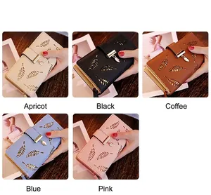 Detailed view of hollow leaf pattern and metal leaf pendant on long PU leather wallets
