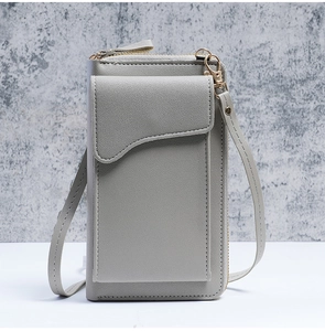 Close-up of grey litchi texture leather crossbody phone bag with metal hardware