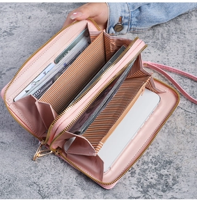 Detail view of pink double zipper long wallet showing large capacity and internal slots
