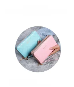 Detail view of double zipper long wallets with quilted texture and wristlet straps