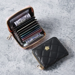 Pink and black quilted wristlet wallets with multiple card slots and floral gold hardware