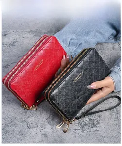 Close-up of double zipper wallets with diamond quilted pattern in black and red colors