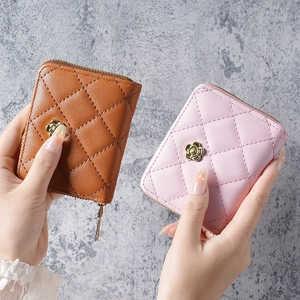 Quilted faux leather wristlet wallet with gold flower buckle in brown and pink