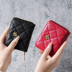 Quilted luxury wristlet wallet with camellia gold hardware in black and red colors