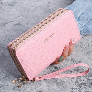 Detail of light pink pebbled leather wallet with double zipper and quilted pattern