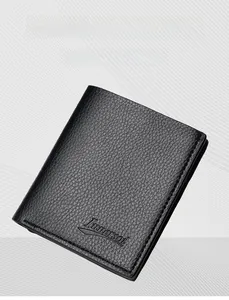 Detailed close-up of men's slim black wallet showing litchi grain texture and embossed logo