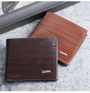 Close-up of business men's bi-fold wallets in dark and light brown with wood grain texture