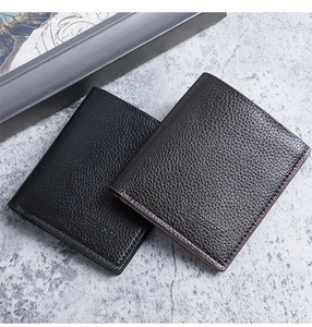 Detail view of black and coffee men's wallets with lychee pattern and embossed logo