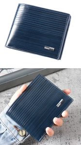 Close-up of navy blue men's wallet with textured stripes and metallic logo plaque