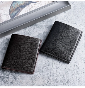 Close-up of minimalist black and brown lychee grain leather wallets for men