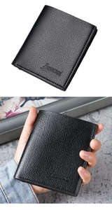 Detail of black lychee grain leather wallet with embossed logo in a hand-held view