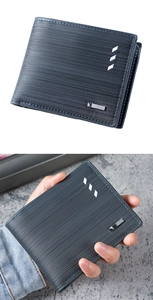 Detailed view of men's blue bifold wallet with textured surface and metal trim accent