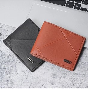 Close-up of litchi texture leather wallets with geometric stitching and metal detail