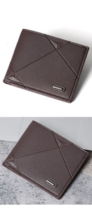 Close-up of a brown leather wallet with geometric stitching next to a laptop on a desk