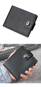 Close-up of black bifold wallet with lychee texture and secure metal snap closure