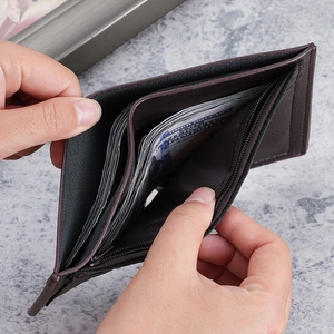 Brown leather vertical bifold wallet with multiple cash slots and secure zipper pocket