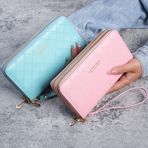 Women's long double zipper wallet with quilted diamond pattern in blue and pink
