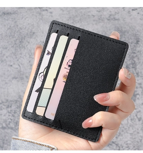 Detailed close-up of slim black lychee texture card holder with three vertical slots